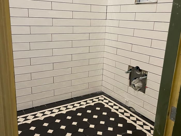 Toilet with a mosaic tile floor, Rotterdam