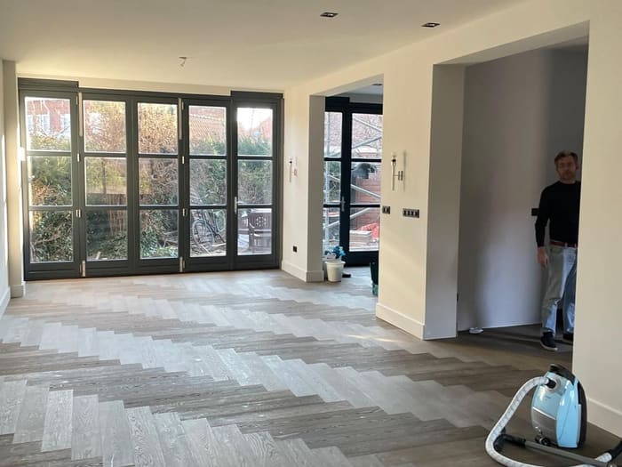 Extension with folding doors and a chevron parquet floor, Den Haag